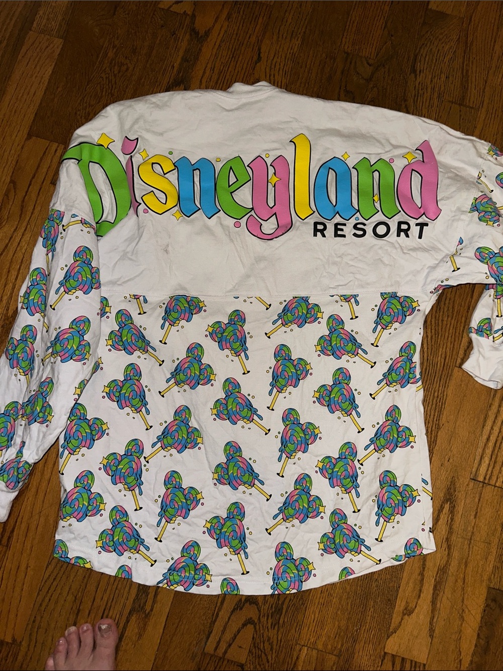 Disney spirit jersey with Bright Green 'D' and Multicolor Swirl Lollipop